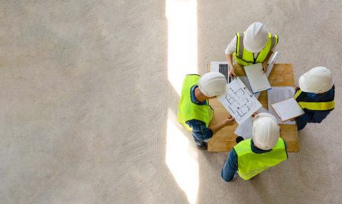 Whitecode building services engineers discussing drawings and plans